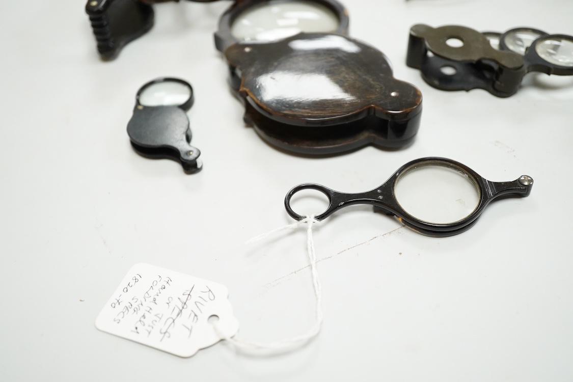 A group of 19th-century horn framed loupes, quizzing glasses and four optician multiple lens sizing lorgnettes (13)